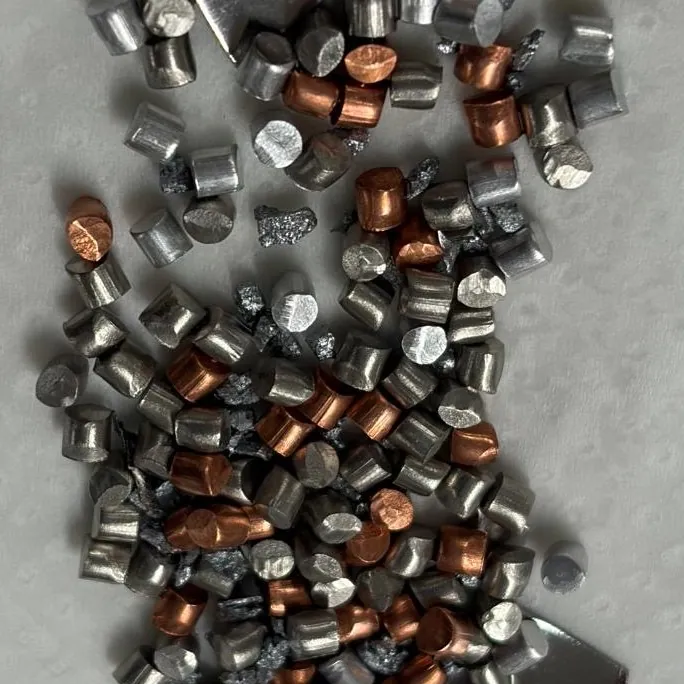 Small pieces of raw metal laid out before a melt