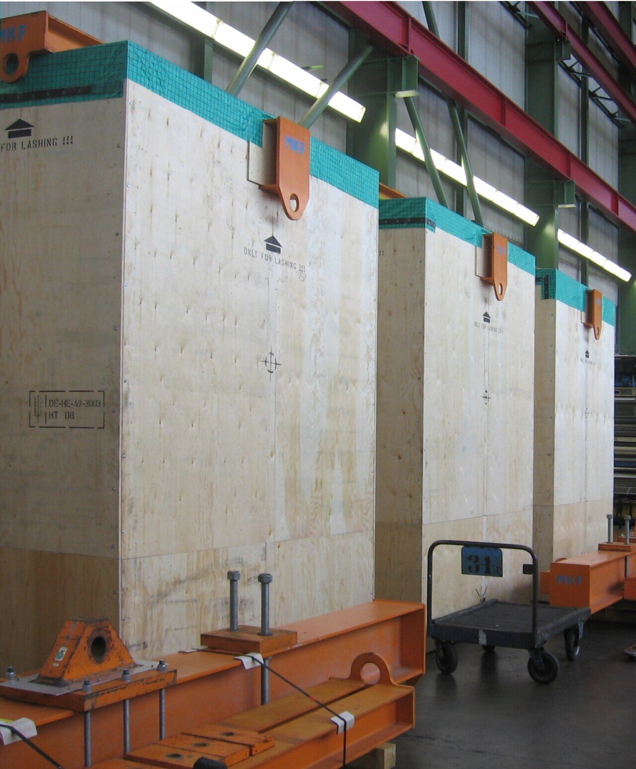 Large plywood export crates in a factory hall, ready to ship